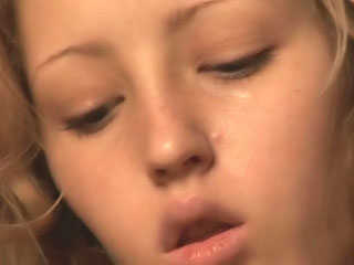Adorable golden-haired teen stripping and fingering wet pussy